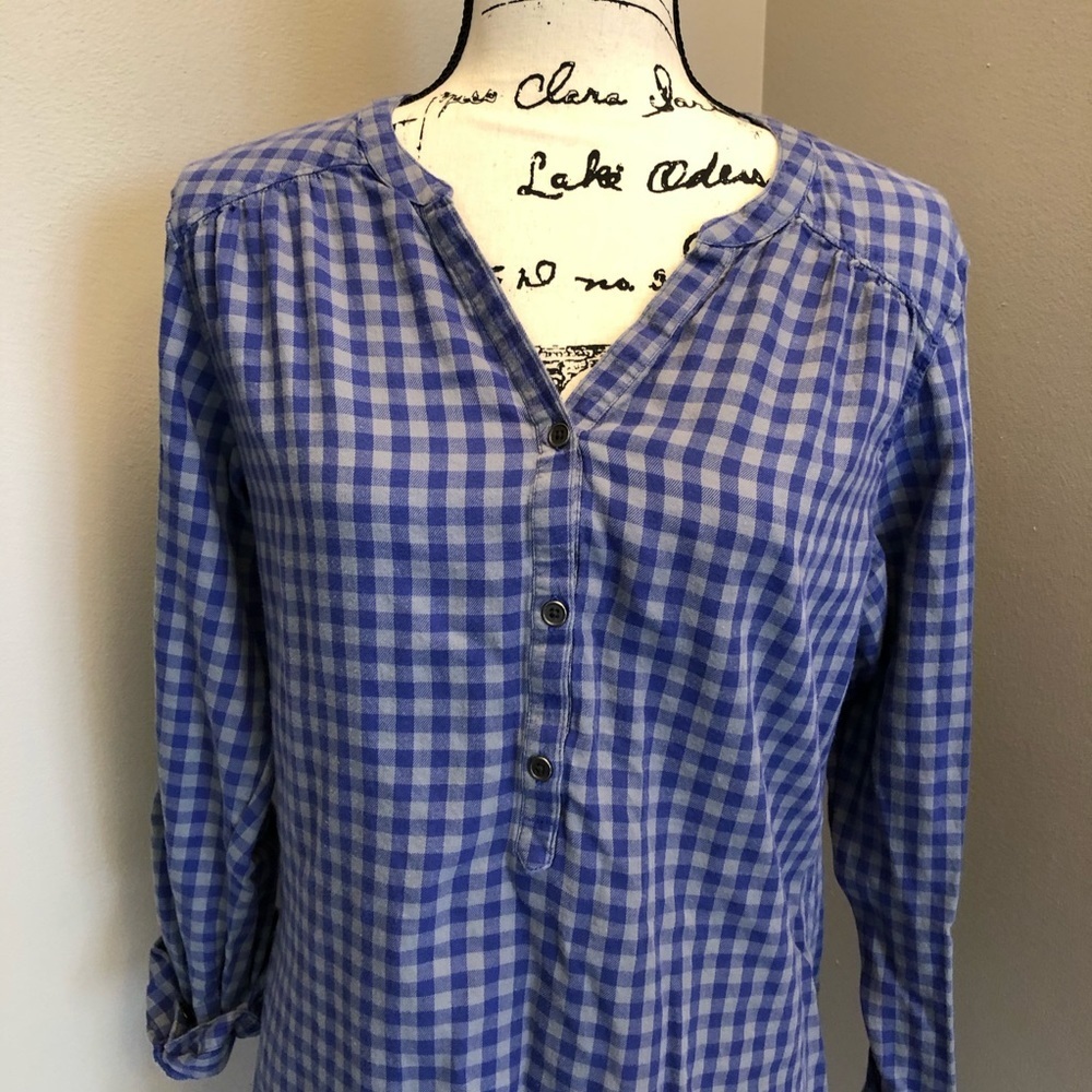 Columbia flannel. Half button up top.